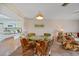 Dining area with wicker chairs and glass table at 25275 Rampart Blvd # 1404, Punta Gorda, FL 33983