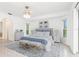 Primary bedroom with king-size bed and neutral decor at 18882 Ayrshire Cir, Port Charlotte, FL 33948