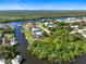 Wide aerial showcasing waterfront property and neighborhood at 18882 Ayrshire Cir, Port Charlotte, FL 33948