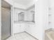 Bathroom with white cabinets, a large vanity, and shower at 18882 Ayrshire Cir, Port Charlotte, FL 33948