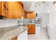 Kitchen boasting granite countertops and wood cabinetry at 18882 Ayrshire Cir, Port Charlotte, FL 33948