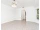 Spacious bedroom with tile floors and access to bathroom at 18882 Ayrshire Cir, Port Charlotte, FL 33948