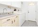Laundry room with washer/dryer hookups and a sink at 18882 Ayrshire Cir, Port Charlotte, FL 33948
