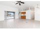 Open living room with kitchen and pool view at 18882 Ayrshire Cir, Port Charlotte, FL 33948