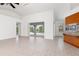Living room with pool access and kitchen bar at 18882 Ayrshire Cir, Port Charlotte, FL 33948