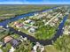 Aerial of canal, showing neighborhood and waterfront homes at 18882 Ayrshire Cir, Port Charlotte, FL 33948