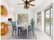 Dining area with table, chairs, and view of the pool through sliding doors at 18882 Ayrshire Cir, Port Charlotte, FL 33948
