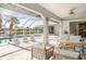 Relaxing pool area with patio furniture and screened enclosure at 18882 Ayrshire Cir, Port Charlotte, FL 33948