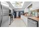Bright kitchen boasts stainless steel appliances and white cabinetry at 1150 Winston St, Port Charlotte, FL 33952