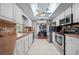 Modern kitchen features white cabinets and stainless steel appliances at 1150 Winston St, Port Charlotte, FL 33952
