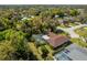 Aerial view of a house with a pool and surrounding landscape at 1150 Winston St, Port Charlotte, FL 33952