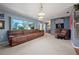 Living area with comfortable seating and large windows at 1150 Winston St, Port Charlotte, FL 33952