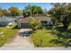 Single-story home with a driveway and well-maintained lawn at 1150 Winston St, Port Charlotte, FL 33952