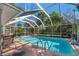 Inviting screened pool with ample surrounding space for relaxation at 1150 Winston St, Port Charlotte, FL 33952