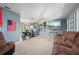 Spacious living room with large sectional sofa and wall-mounted TV at 1150 Winston St, Port Charlotte, FL 33952