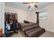 Bedroom with a leopard print bedspread and clothes rack at 1150 Winston St, Port Charlotte, FL 33952