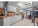 Kitchen with white cabinets, stainless steel appliances, and tile floor at 1150 Winston St, Port Charlotte, FL 33952