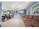 Living room featuring sectional sofa and large TV at 1150 Winston St, Port Charlotte, FL 33952