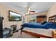 Bedroom with large TV and wooden dresser at 1150 Winston St, Port Charlotte, FL 33952