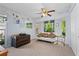Bedroom with bay window, white couch, and ceiling fan at 1150 Winston St, Port Charlotte, FL 33952
