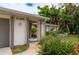 Front entry with walkway leading to covered porch at 1150 Winston St, Port Charlotte, FL 33952