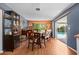 Dining room with wood table and chairs, and access to the pool area at 1150 Winston St, Port Charlotte, FL 33952