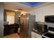 Kitchen with stainless steel appliances and an adjacent workspace at 6800 Placida Rd # 144, Englewood, FL 34224