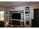 Living room with built-in entertainment center and electric fireplace at 6800 Placida Rd # 144, Englewood, FL 34224