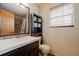 Clean bathroom with updated vanity and tiled shower at 16115 Aralia Dr, Punta Gorda, FL 33955