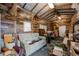 Large workshop with wood-paneled walls, a couch, and plenty of storage at 16115 Aralia Dr, Punta Gorda, FL 33955
