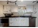 Updated kitchen with white cabinets and dark countertops at 16115 Aralia Dr, Punta Gorda, FL 33955