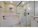 Modern bathroom with a soaking tub and a glass shower enclosure at 16115 Aralia Dr, Punta Gorda, FL 33955