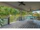 Relaxing covered back porch with seating area, overlooking a spacious backyard at 16115 Aralia Dr, Punta Gorda, FL 33955