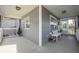 Covered front porch with white bench and small stool at 16115 Aralia Dr, Punta Gorda, FL 33955