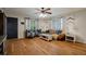 Living room with hardwood floors, a comfy couch, and two armchairs at 16115 Aralia Dr, Punta Gorda, FL 33955