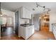Kitchen with white cabinets, gray countertops, and pantry at 16115 Aralia Dr, Punta Gorda, FL 33955