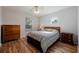 Spacious bedroom with hardwood floors and a charming window at 16115 Aralia Dr, Punta Gorda, FL 33955