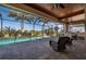 Relaxing screened-in pool area with outdoor kitchen and golf course views at 669 Monaco Dr, Punta Gorda, FL 33950