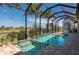 Relaxing screened-in pool with spa and adjacent patio at 669 Monaco Dr, Punta Gorda, FL 33950