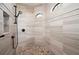 Large walk-in shower with modern fixtures and elegant tile at 669 Monaco Dr, Punta Gorda, FL 33950