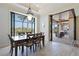 Bright dining room with sliding glass doors leading to a relaxing patio area at 669 Monaco Dr, Punta Gorda, FL 33950