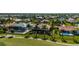 Aerial showing homes, landscaping, and canal views at 669 Monaco Dr, Punta Gorda, FL 33950