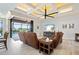 Open living area with coffered ceiling, sliding doors to lanai and pool at 669 Monaco Dr, Punta Gorda, FL 33950