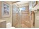 Spa-like bathroom with glass shower, built-in seat, and updated fixtures at 1700 Los Alamos Dr, Punta Gorda, FL 33950