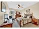 Spacious bedroom with king-size bed, ceiling fan, and ample closet space at 1700 Los Alamos Dr, Punta Gorda, FL 33950