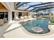 Resort-style pool with spa and outdoor kitchen at 1700 Los Alamos Dr, Punta Gorda, FL 33950