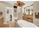 Spacious bathroom with soaking tub, double vanity, and ceiling fan at 1700 Los Alamos Dr, Punta Gorda, FL 33950