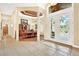 Elegant entryway with tile flooring and views to the dining room and a bathroom at 1700 Los Alamos Dr, Punta Gorda, FL 33950