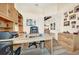 Spacious home office with built-in wooden desk and cabinets at 1700 Los Alamos Dr, Punta Gorda, FL 33950