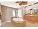 Spa-like bathroom with soaking tub and double vanity at 1700 Los Alamos Dr, Punta Gorda, FL 33950